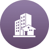 Icon of a house and buildings on a purple circular background.